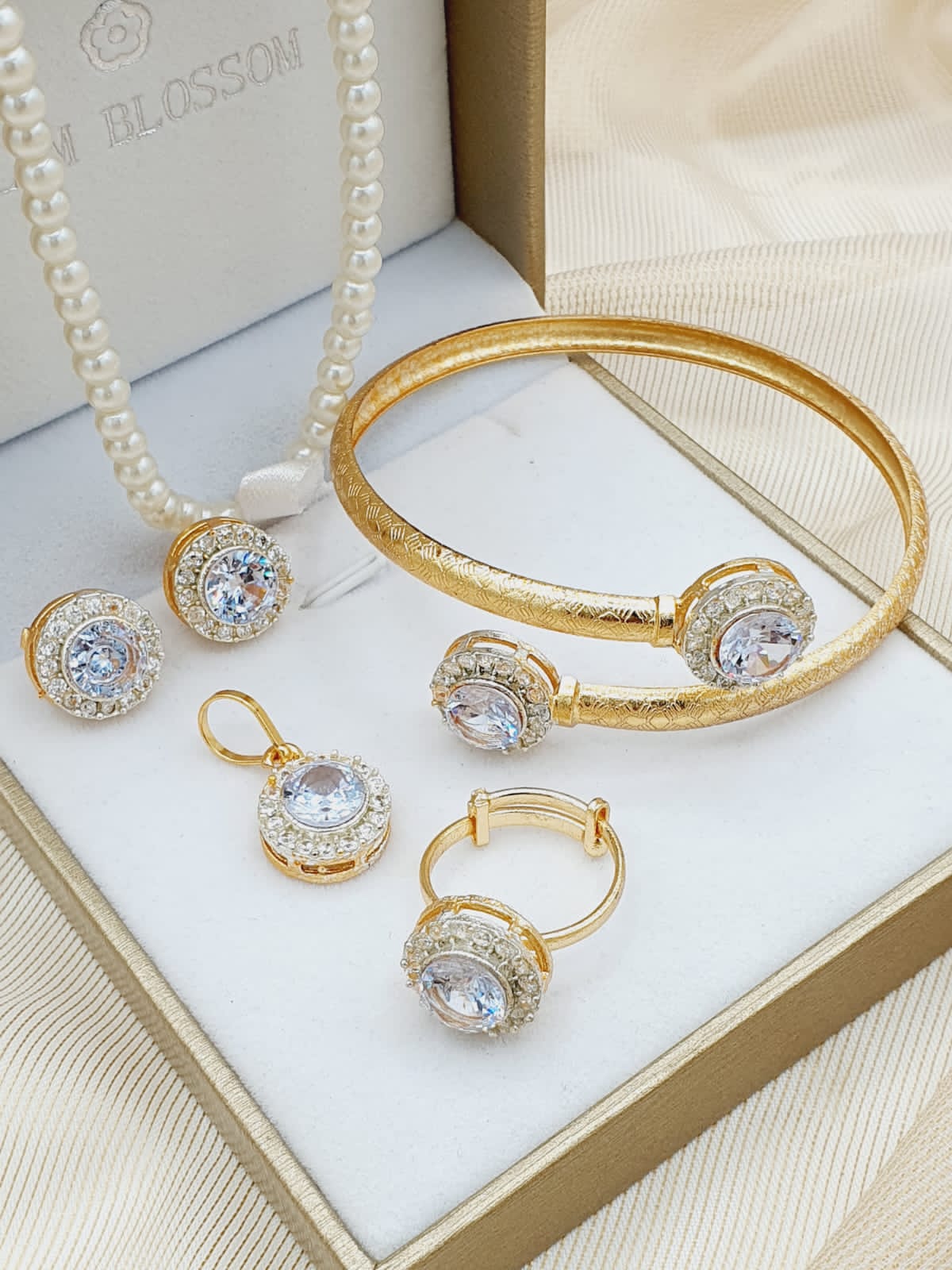 combo set in gold color with white crystal stones