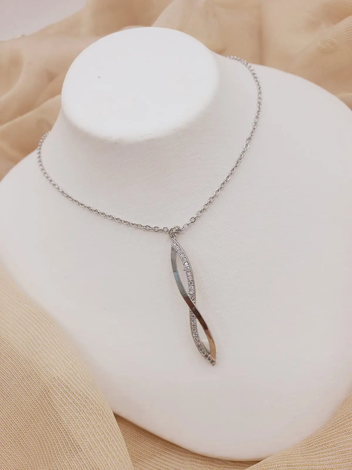 silver color chain locket with zircon stones